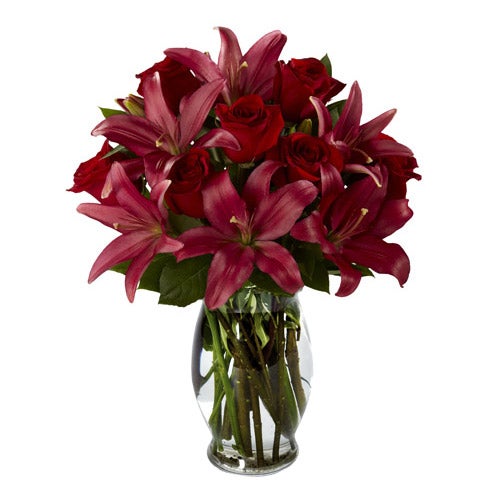 A Bouquet of Red Burgundy Roses, Burgundy Asiatic Lilies and Lush Greens in a Designer Glass Vase