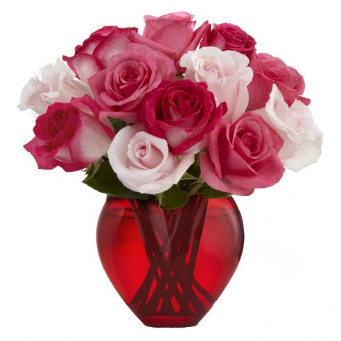 A Bouquet of Fuchsia Roses, Pale Pink Roses and Bi-colored Pink Roses in a Heart-shaped Glass Vase