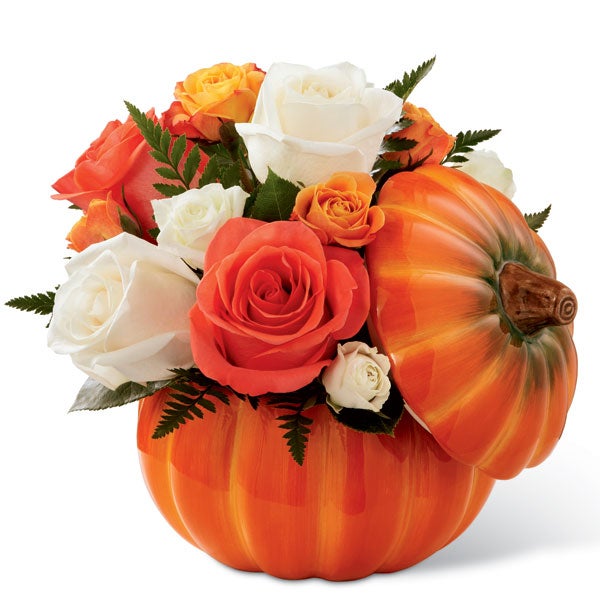 A Bouquet of Orange Roses, White Roses, Orange Spray Roses, and White Spray Roses in a Pumpkin Container