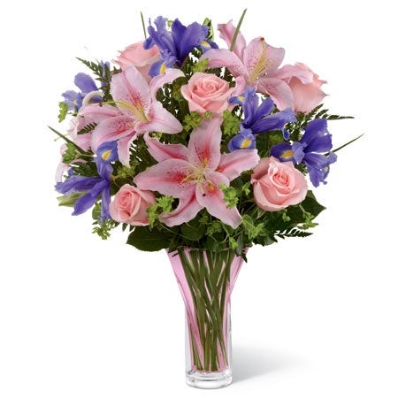 Sweetly elegant bouquet of pink roses, pink oriental lilies, blue irises, and lush greens
