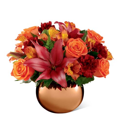 A Bouquet of Orange Roses, Red Lilies, Red Carnations and Orange Flowers in an Orange Vase