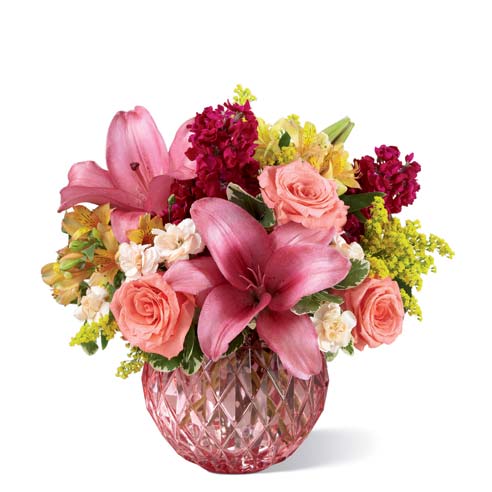 Miniature pink carnations, pink stock and pink roses bouquet with pink vase