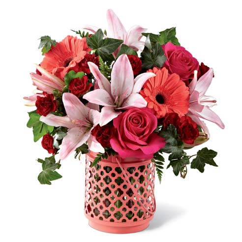 Coral flower candle lantern vase bouquet with coral gerbera daisies and pink lily