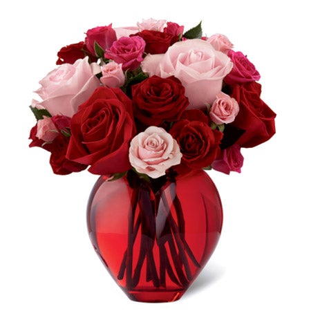 Heart shaped vase with a combination of dark red and light pink roses