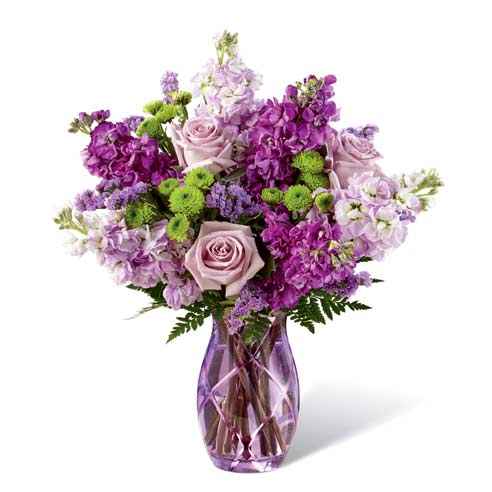 Purple flower bouquet with purple roses, lavender roses, purple stock flowers, and green mums