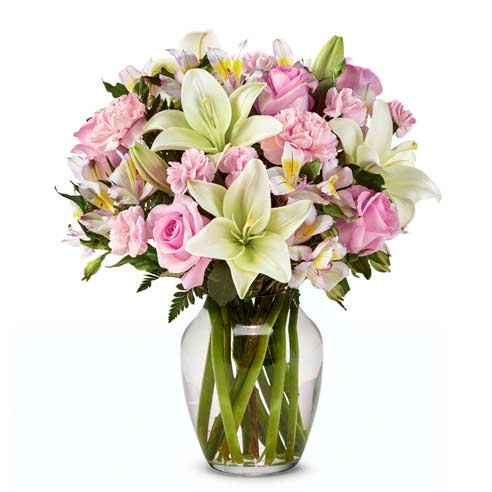 Spring flower bouquet, a white lily and pink rose spring flower arrangement in vase