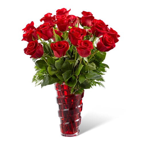 A Bouquet of  12 Pieces to 24 Pieces Long-Stemmed Red Roses and Leatherleaf in a Dark-Red Colored Glass Vase