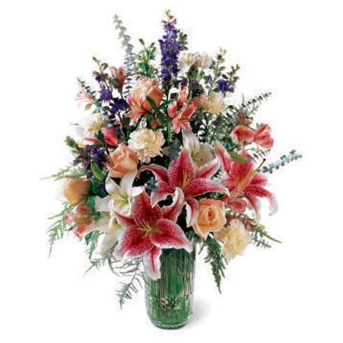 Luxury stargazer lily bouquet in green glass vase