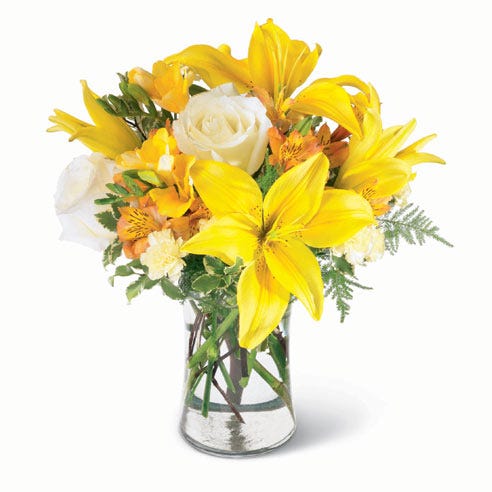 Yellow lilies, white roses and yellow carnations