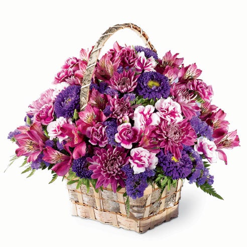 A Bouquet of  Purple Alstroemeria, Variegated Purple Mini Carnations, Purple Cushion Poms, Deep Purple Statice and Deep Purple Matsumoto Asters in a Birchbark Handled Basket