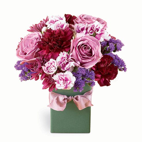 Lavender rose, burgundy carnations, and lavender miniature carnations bouquet