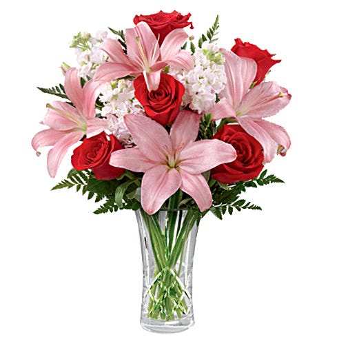 Pink lilies, red roses and white flowers
