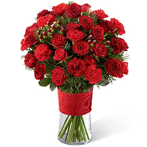 A bouquet of Red Spray Roses, Burgundy Mini Carnations and Red Hypericum Berries in a Glass Vase with Ribbon