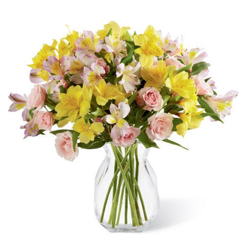 Yellow peruvian lilies and pink spray rose bouquet