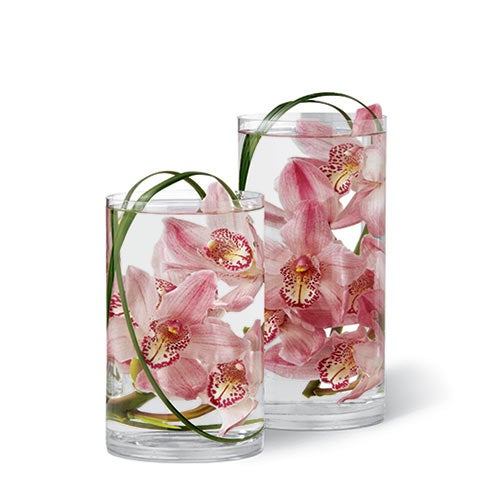 Floating orchids in glass vase