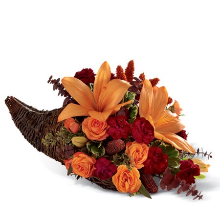 A Bouquet of  Peach Lilies, Orange Roses, Burgundy Mini Carnations and Eucalyptus in a Natural Cornucopia Basket