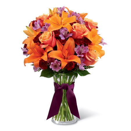 Orange lil bouquet with purple flowers and mini red carnations