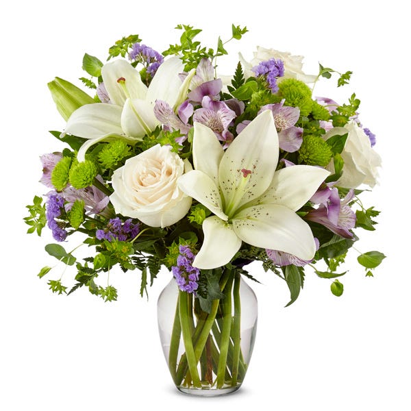 Lavender white lily arrangement with white roses