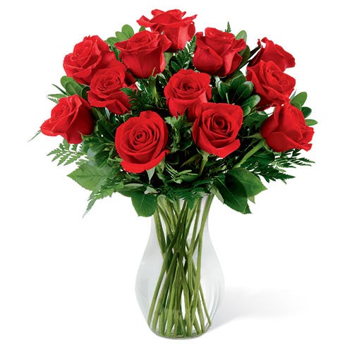 A Bouquet of  24 Red Rose Stems and Fresh Cut Greenery in a Clear Glass Vase