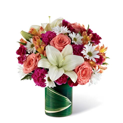 Coral roses and lily roses in a modern vase