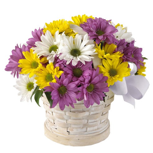 A bouquet of Lavender, Yellow And White Daisies on a Washed Basket