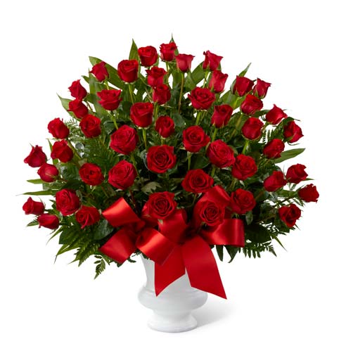 Red rose bouquet delivered in a sympathy urn