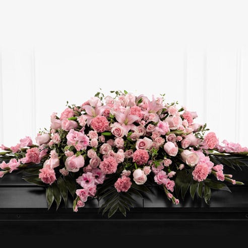Pink Floral casket spray with roses, carnations and lilies