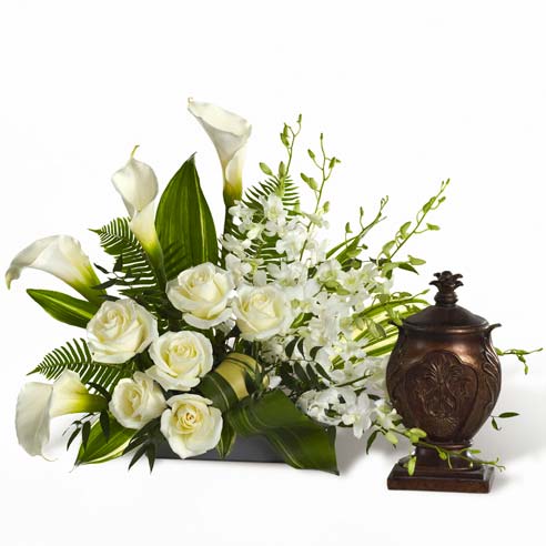 White rose and white calla lily urn flower arrangement for funeral or wake
