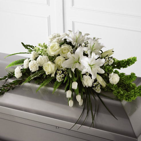 All White Casket Funeral Spray In Warwick, RI Petals Funeral Flowers