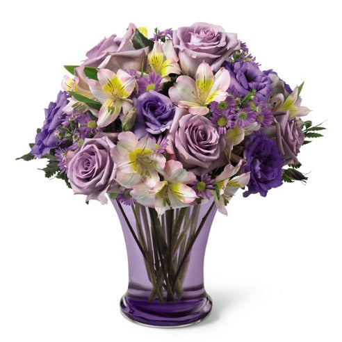 Beautiful purple roses and purple flower arrnagement at send flowers for flower delivery