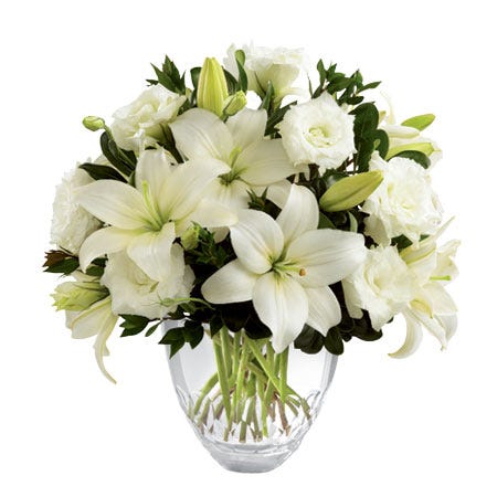 White asiatic lilies, lisianthus and white flowers in a floral delivery