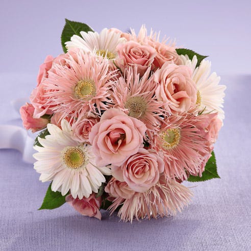 Pink gerbera daisies in a florist delivered bouquet