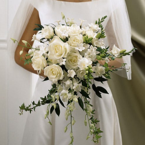 White rose and orchid handheld bride wedding bouquet with white freesia