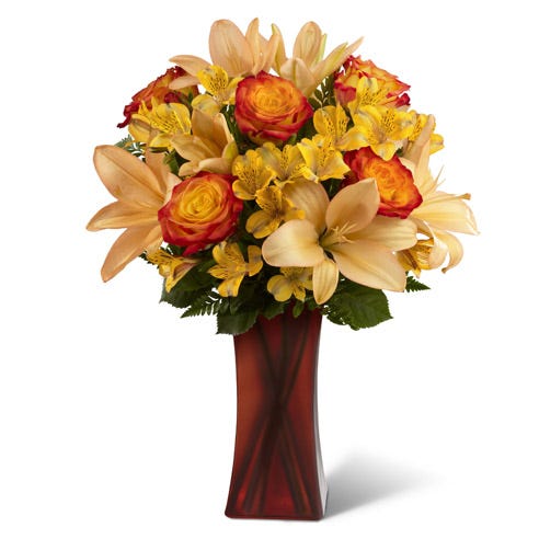 Bi-colored roses, yellow peruvian lilies and orange lilies