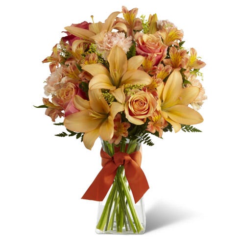 Orange roses, peach asiatic lilies and orange carnations bouquet