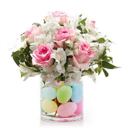 A Bouquet of Pink Roses, White Alstroemeria, and Fresh Greens in a Keepsake Glass Vase with a Plastic Easter Eggs