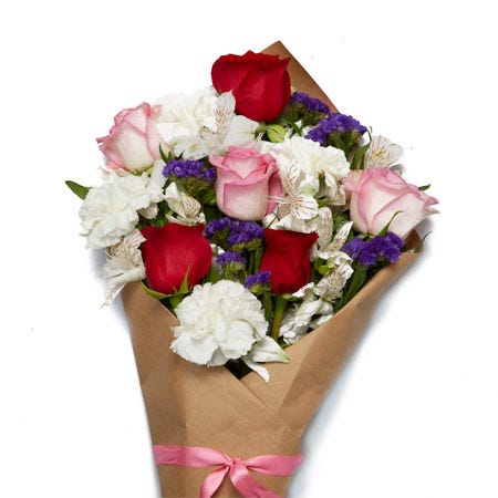 Wrapped flowers same day delivery with red roses, pink roses and carnations