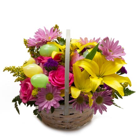 Easter eggs and flowers in a basket