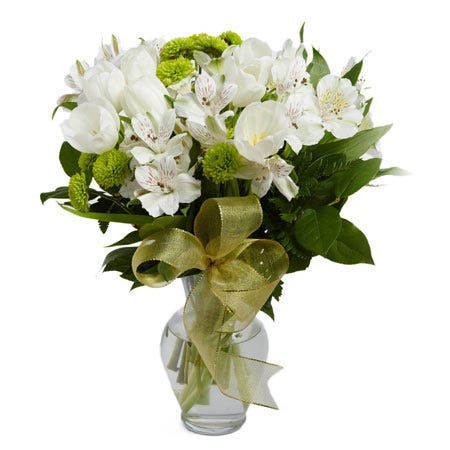 White tulips, white alstroemeria and green poms in a vase