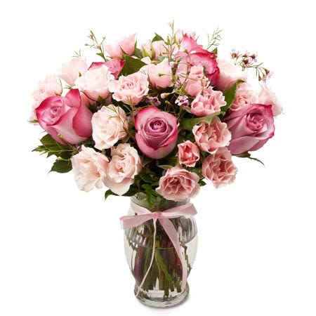 Pastel bouquet with bi color purple roses and pale pink carnations