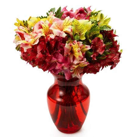 Mixed alstroemeria bouquet with red vase