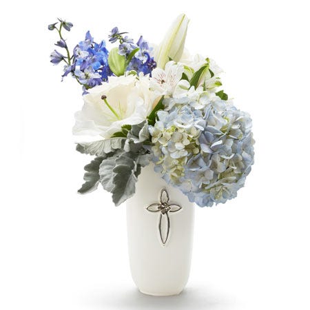 Cross flower bouquet with blue hydrangea and delphinium