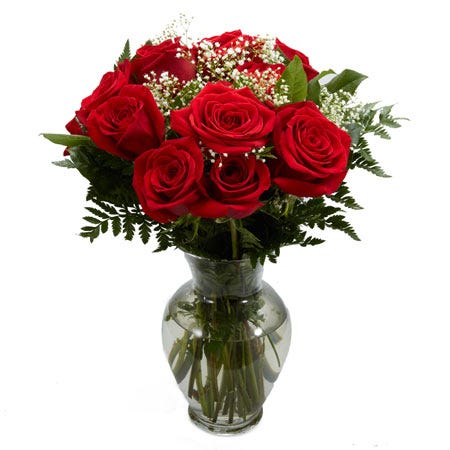 10 red roses with white babies breath and greens in a clear glass vase