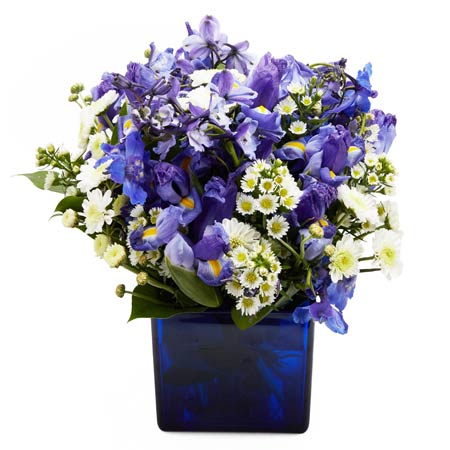 Blue flower bouquet with blue iris and white daisies and white carnations