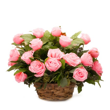 Pink roses basket bouquet in a woven basket with a card message