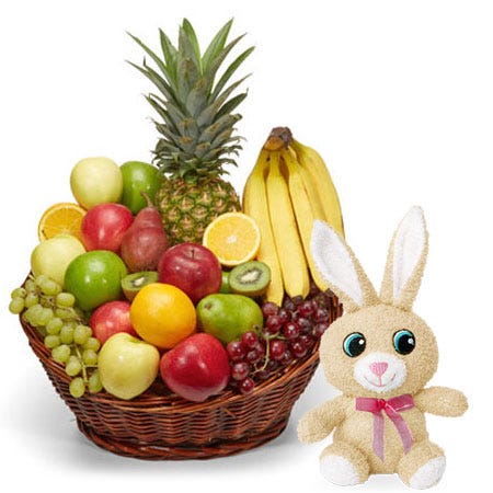 Mixed pineapple and fruits Easter gifts basket with a stuffed animal bunny toy