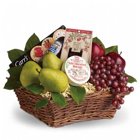 Assorted Snack And Fruits, Soft Cheese, Crackers, Summer Sausage and Dried Cranberries on a basket