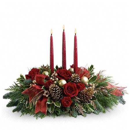 Red candle flower centerpiece with red roses, pinecones and christmas flowers