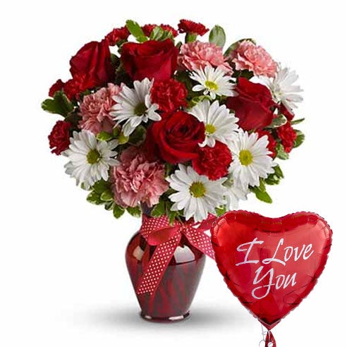 A Bouquet of Red Roses, Pink Carnations, Red Mini Carnations and White Daisy Spray Mums in a Red Vase with 1 Heart-Themed Mylar Balloon