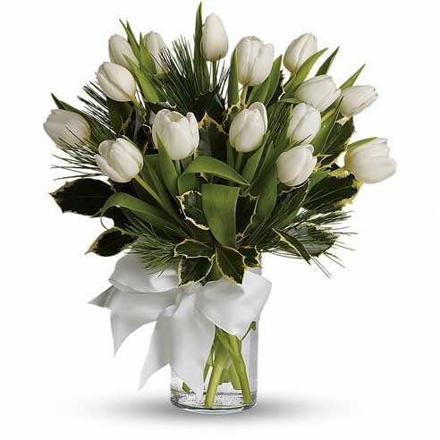 A Bouquet of  Ivory Tulips Bunch, Greens, Pine, and Holly in a Glass Vase with Cream Bow